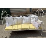 A Victorian white painted metal child's/dolls bed