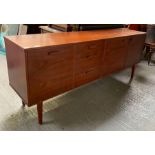 A mid century Avalon teak sideboard, with three sh