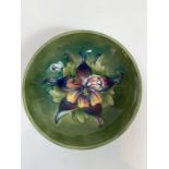 A small Moorcroft round footed bowl, tubelined and