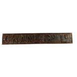 A rectangular cast iron sign 'Crane Co Ld', with b