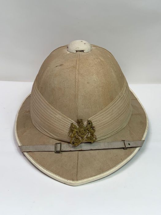 A 19th/20th century military pith hat, retailed by Griffiths Mcallister