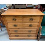An Edwardian walnut chest of two short and three l