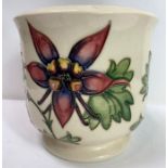 A Moorcroft circular pot on footed base, tubelined