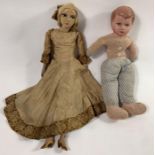 A c.1920's boudoir doll with moulded and painted f