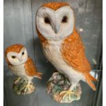 A Beswick figure of a barn owl standing on a leafy