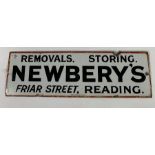 A rectangular enamel sign, white ground with red b