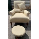A Victorian open armchair, on four block and turne