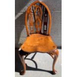 A 20th century yew wood gothic style chair, retail