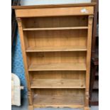 A 20th century pine bookcase, with four adjustable