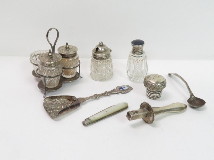 A small silver cruet frame with a glass salt, and