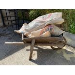 Wooden garden wheelbarrow together with a quantity