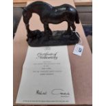 A bronzed resin figure of a carthorse and foal, 15