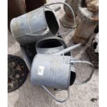 3 galvanized watering cans & a galvanized tub