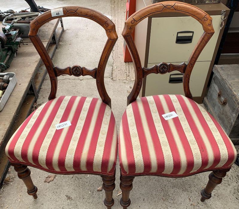 Pair of stained oak dining chairs with striped uph