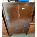 Stained oak cabinet with cupboard doors to the top