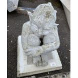 Garden statue of a seated goblin/pixie