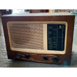 Vintage radio in veneered wood case