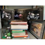 Shelf of motorcycle books, boxed car/cycle scale m