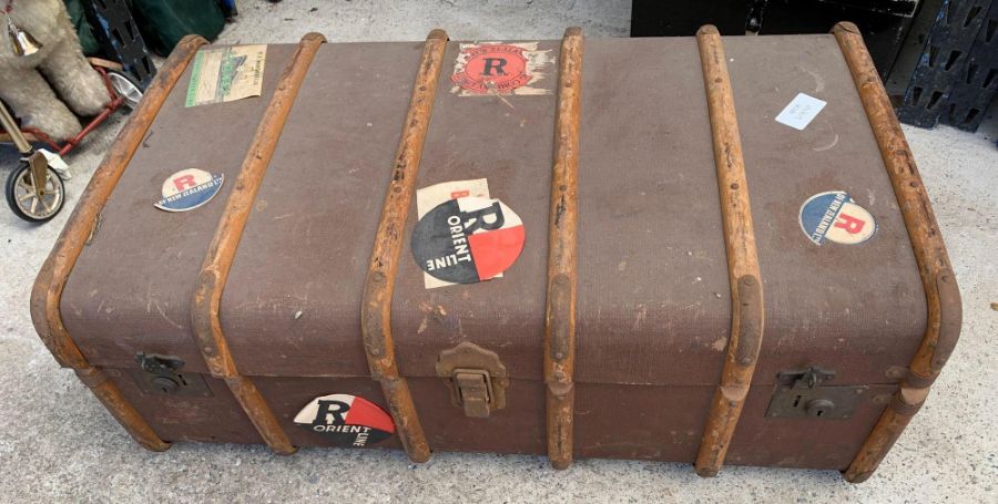 Wood bound canvas travelling trunk with various pa