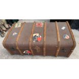 Wood bound canvas travelling trunk with various pa