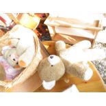 Wicker basket containing various teddies