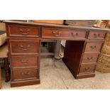 Modern mahogany twin pedestal desk with green leat