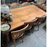 Rectangular pine kitchen table together with 8 cha