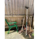 Pair of green painted bench ends together with var