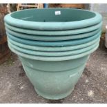 7 green plastic planters