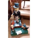 Modern moneybox in the form of 'Uncle Sam' smoking
