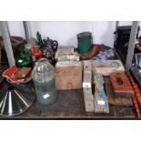 Shelf of wooden moldings, teapots, earthenware etc