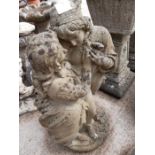 Reconstituted stone garden statue of lovers in Ren