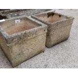 Pair of reconstituted stone planters each with dec
