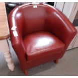 Pair of dark brown leatherette tub chairs together