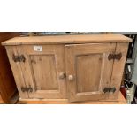 Stripped pine 2 door wall cupboard together with a