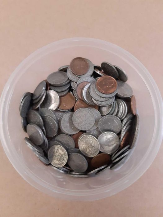 Pot of coins including some