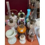 Eleven assorted decorative oil lamps including fac