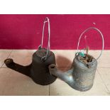 A Wells "Unbreakable" oil lamp with swing carrying