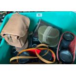 A quantity of binoculars, some in leather cases; a