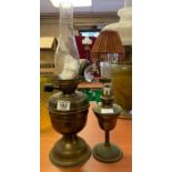 A small brass oil lamp with original slender chimn