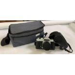 Chinon 35mm SLR camera in case c/w 135mm Zeiss len