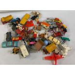 Various playworn Corgi and Dinky toys