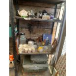 Three shelves of items to include vintage suitcase
