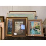 Shelf of assorted framed pictures