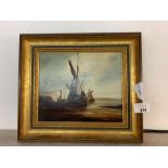 Oil on canvas of a docked ship, signed R B T Moore