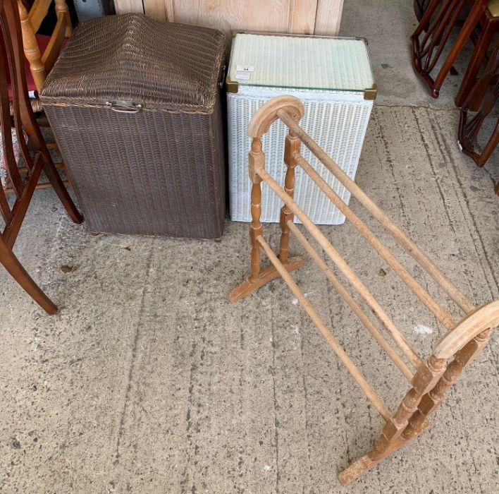 Two Lloyd Loom style linen baskets and towel rail