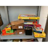 Shelf of childrens games, puzzles, dominoes etc