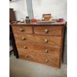 Mahogany chest of drawers with ornate brass handle