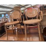 Two rattan and bentwood armchairs, labelled 'dinet