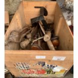 Crate of assorted tools including brass foot pumps